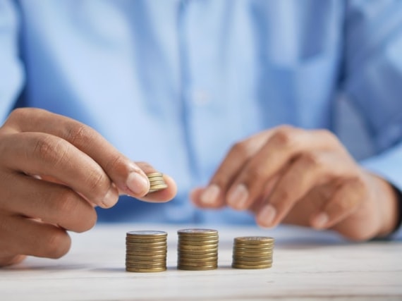 Man stacking coins